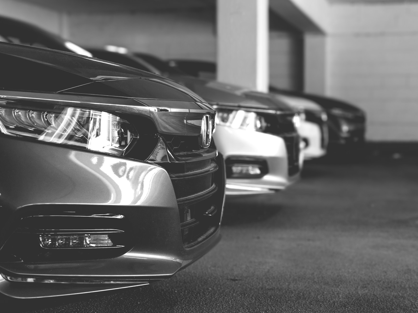 grayscale photo of car on road